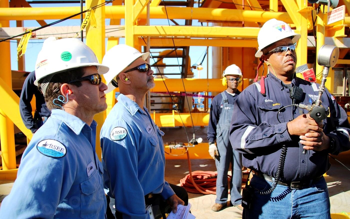 Crew conducting a pre-job safety briefing on location